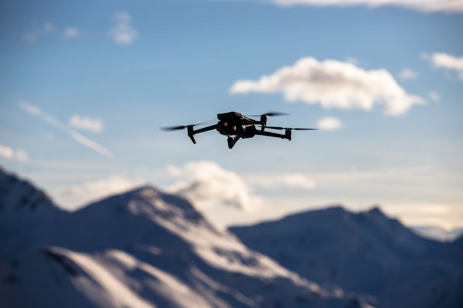 DJI Neo palm launch drone flying in a park