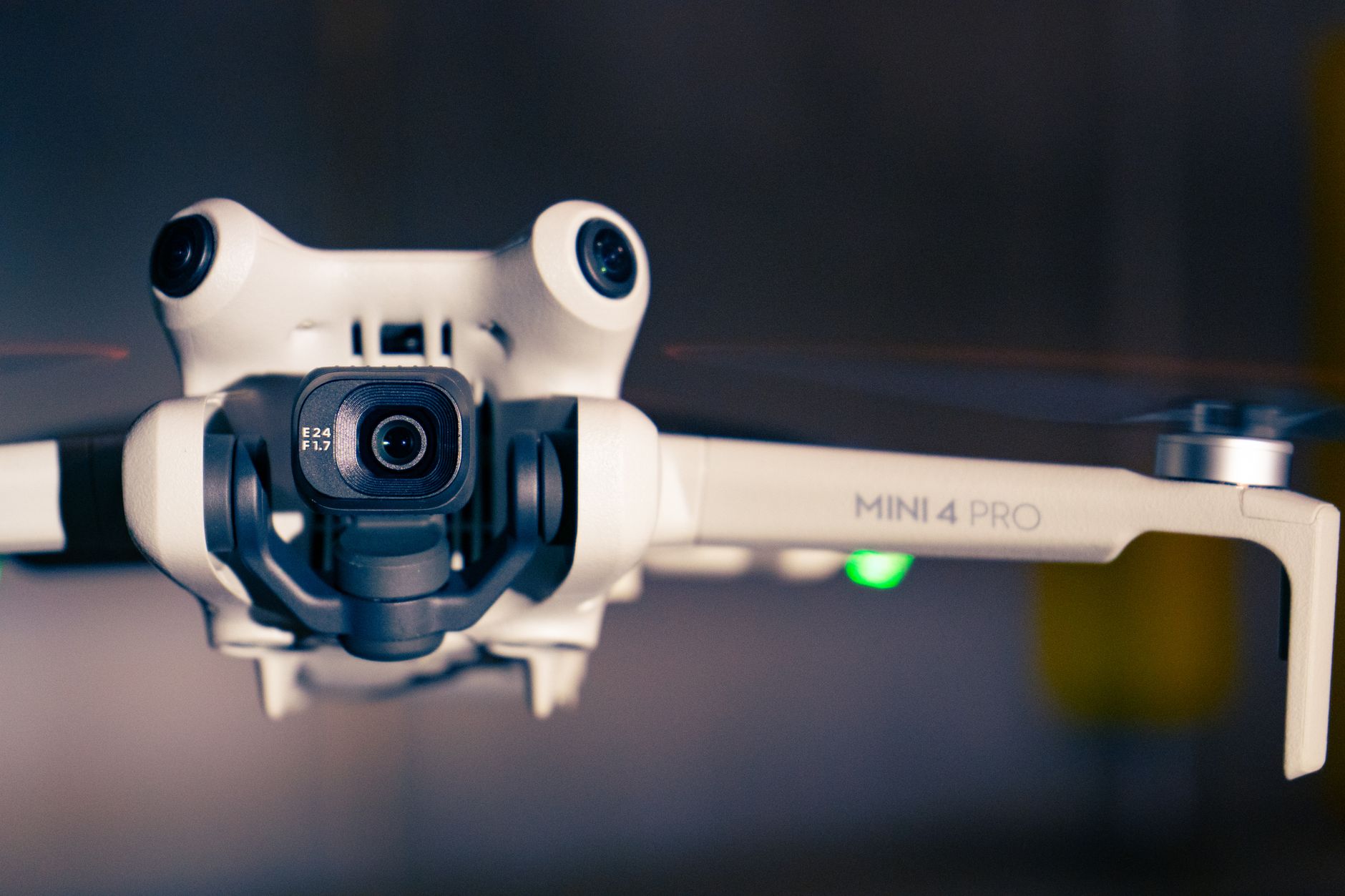 DJI Mini 4 Pro drone hovering during a sunset flight