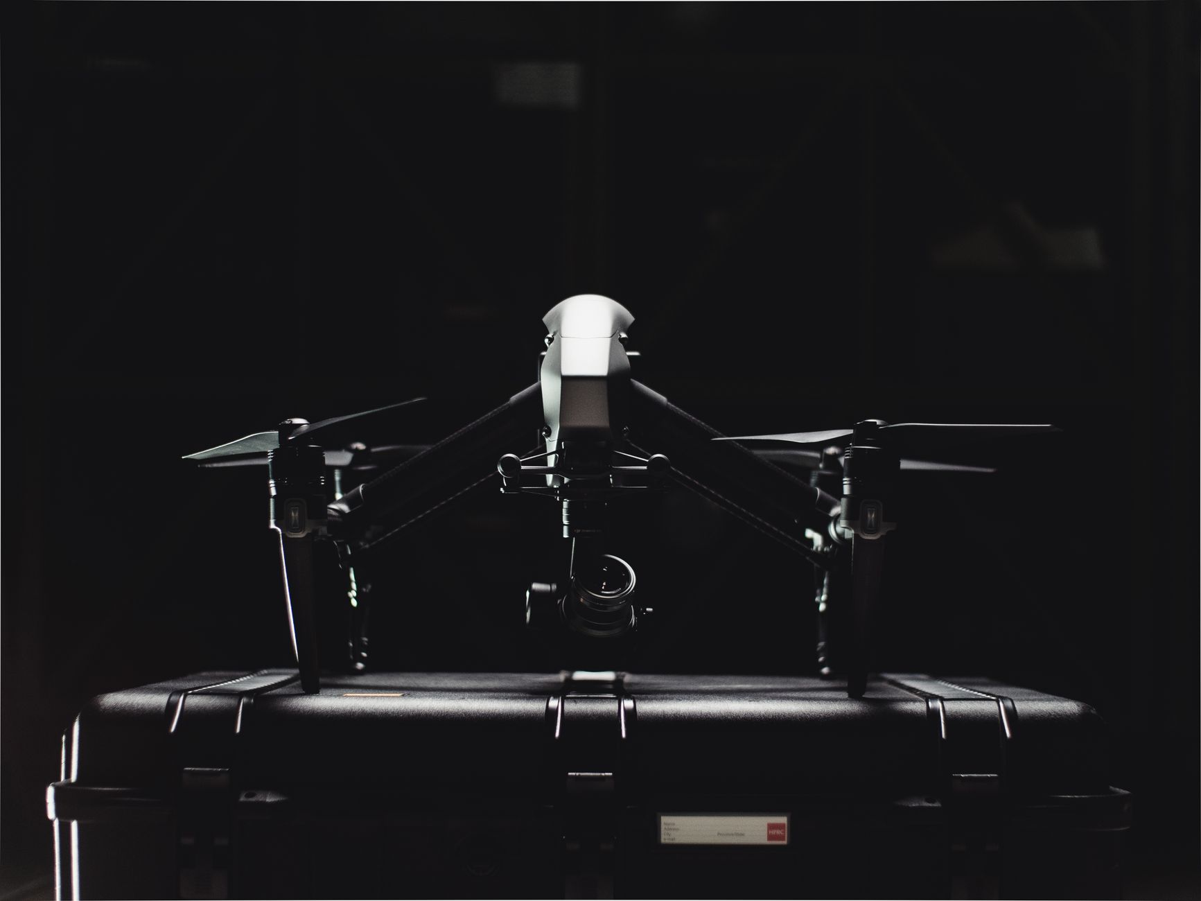 DJI Mini 5 Pro flying over coastal landscape with folded arms