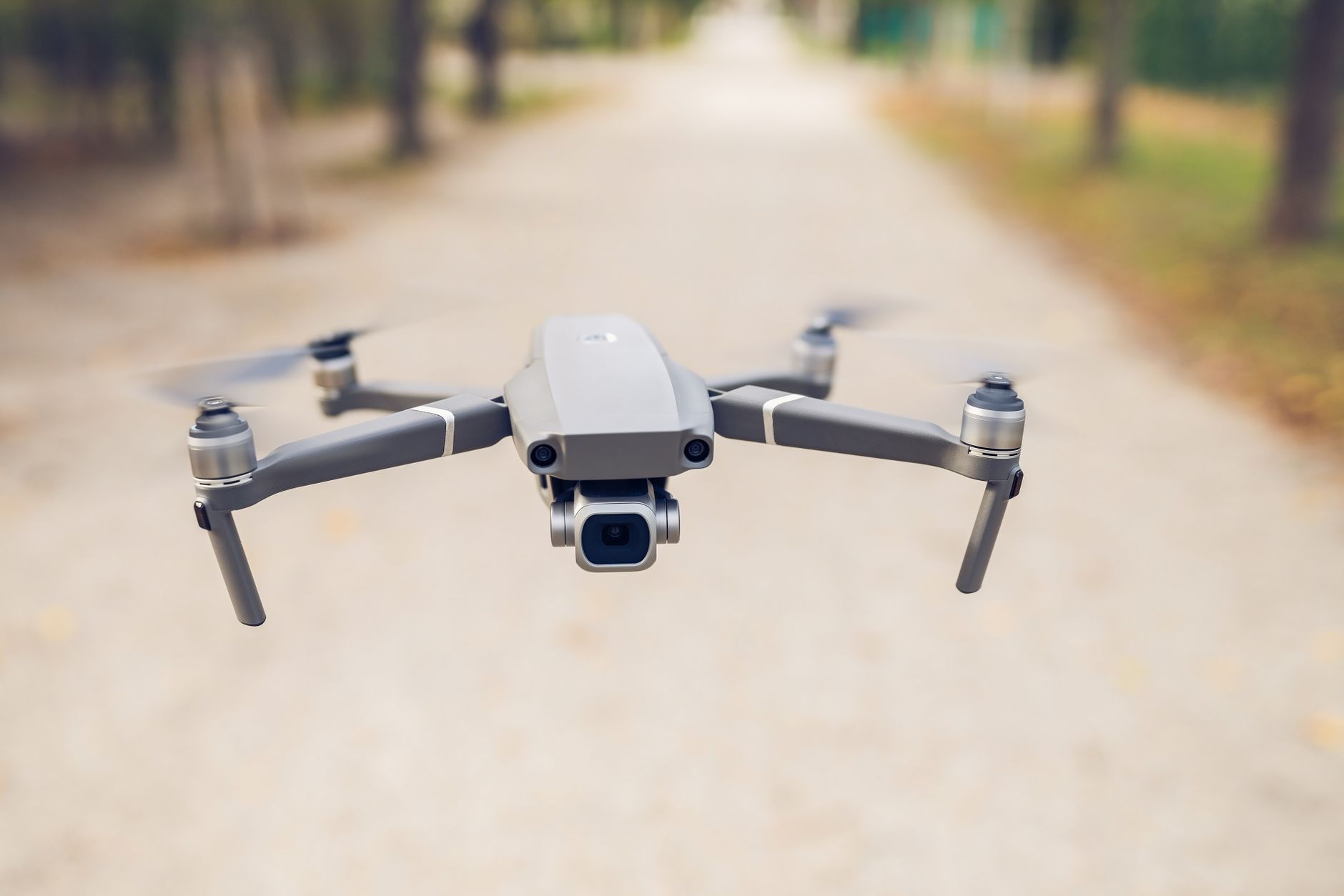 FAA Part 107 study guide and drone remote controller on a desk